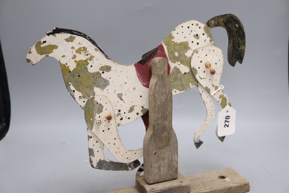 A tin model articulated horse and jockey, c.1990, width 36cm